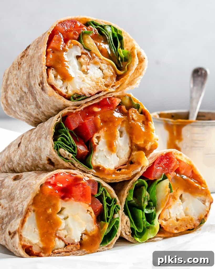 Flavor-Packed Cauliflower Wraps BBQ or Buffalo 2 Stacked BBQ or Buffalo Cauliflower Veggie Wraps, showcasing their delicious filling and perfect for a quick, healthy, and plant-based lunch idea or meal prep.