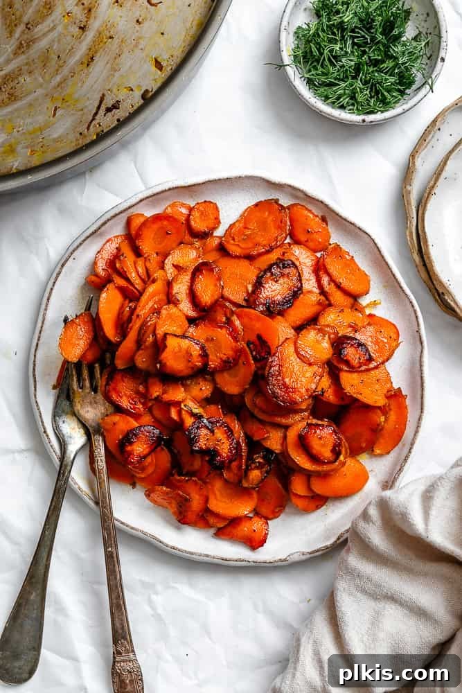 Golden Glazed Carrots 2 A plate of beautifully cooked Simple Sautéed Carrots, garnished with fresh herbs.