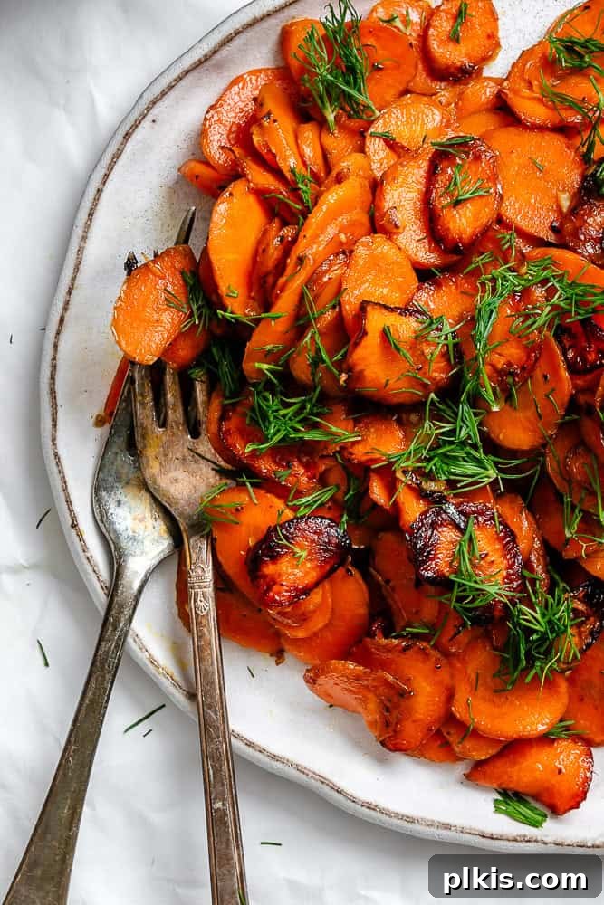 Golden Glazed Carrots 7 A close-up shot of completed Simple Sautéed Carrots on a serving plate.