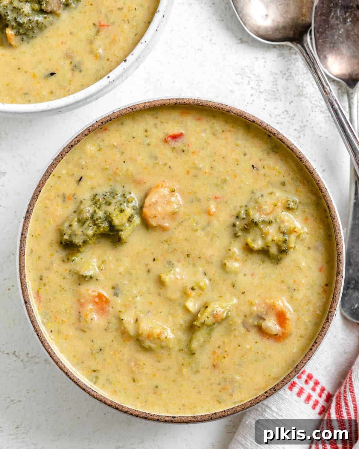 Velvety Vegan Broccoli Bliss 2 completed Cream of Broccoli Soup against a white background
