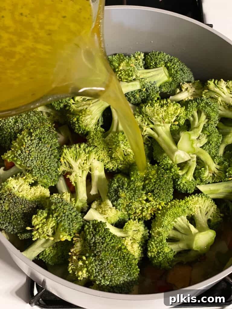 Velvety Vegan Broccoli Bliss 13 process shot of veggie broth being added to pot