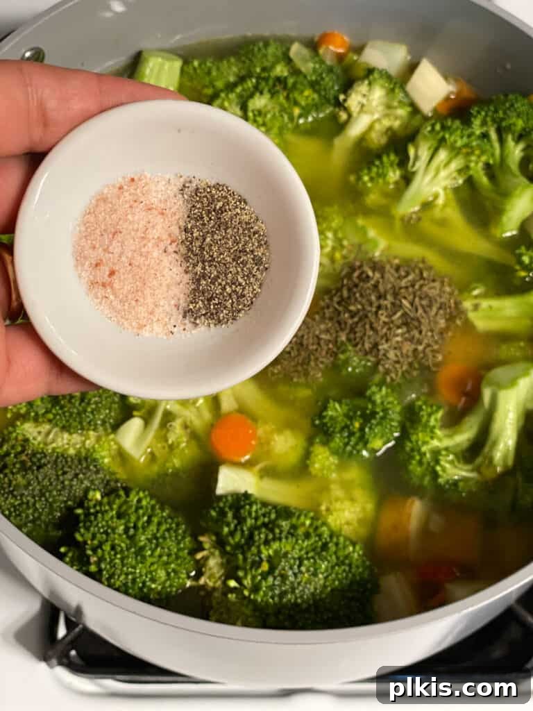 Velvety Vegan Broccoli Bliss 15 process shot of salt and pepper being added to pot