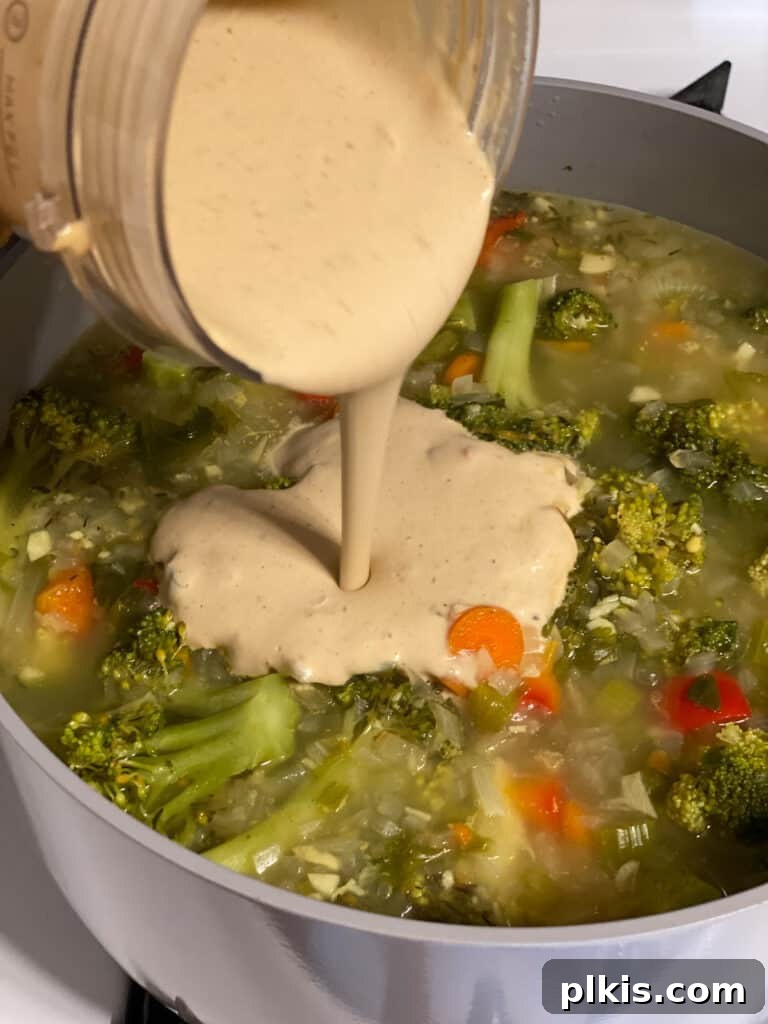 Velvety Vegan Broccoli Bliss 16 process shot of adding cashew mixture to pot