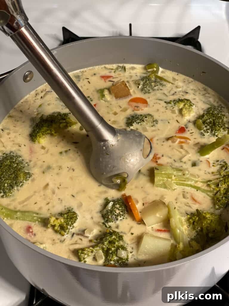 Velvety Vegan Broccoli Bliss 17 process shot of using immersion blender to soup