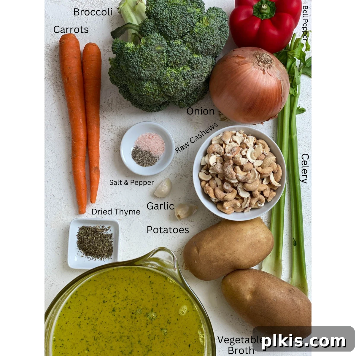 Velvety Vegan Broccoli Bliss 3 ingredients for Cream of Broccoli Soup measured out against a white surface