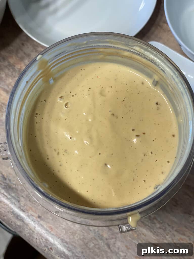 Velvety Vegan Broccoli Bliss 5 process shot showing blended mixture of cashew in blender