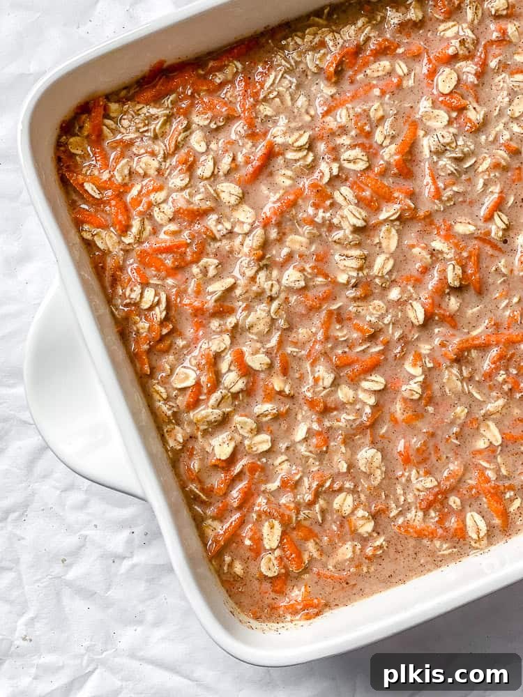 Warm Spiced Carrot Cake Baked Oats 6 The unbaked Carrot Cake Baked Oats mixture, smoothed into a baking dish and ready for the oven, promising a delicious breakfast.