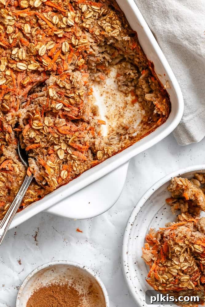 Warm Spiced Carrot Cake Baked Oats 7 Perfectly baked Carrot Cake Baked Oats, golden brown and inviting, resting in a baking dish, ready to be portioned and enjoyed.