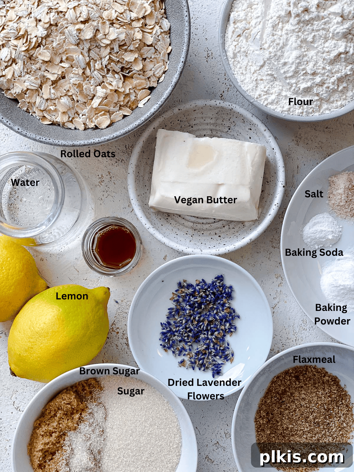 Cookie Ingredients Carefully measured ingredients for lemon lavender cookies laid out on a clean white surface.