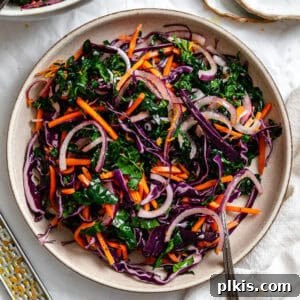 Zesty Kale Slaw Delight 9 completed Crunchy Kale Slaw on a white surface