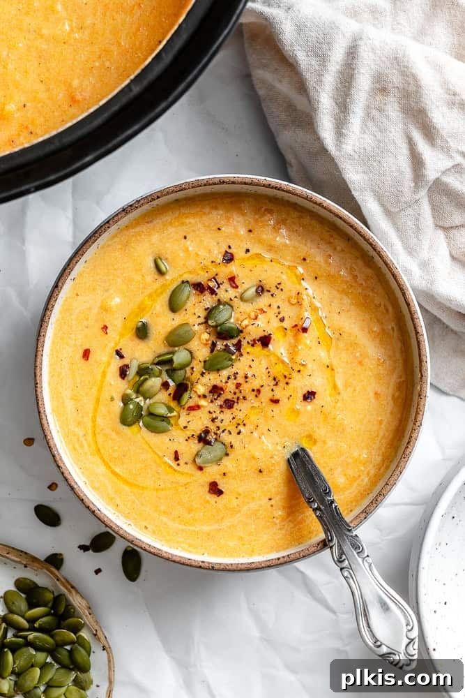 Golden Harvest Bisque 2 completed Roasted Pumpkin Soup in bowl, garnished with herbs