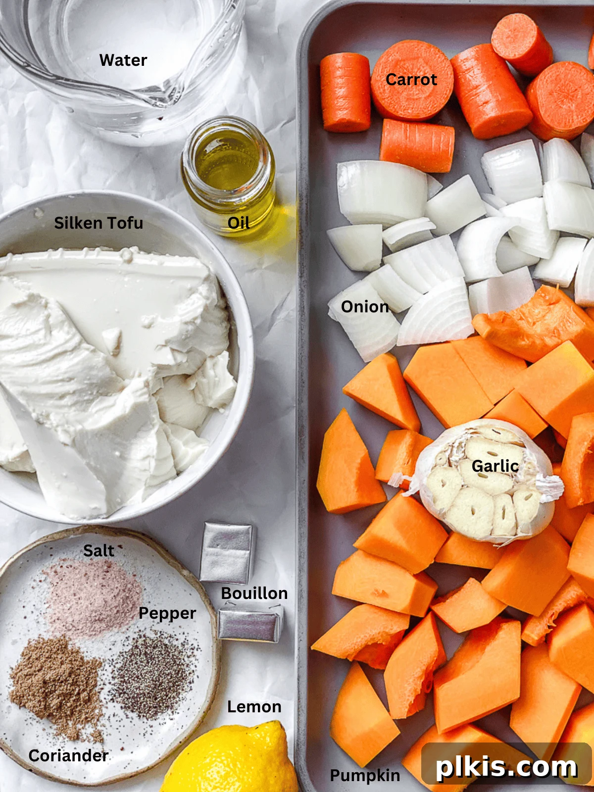 Golden Harvest Bisque 3 ingredients for Roasted Pumpkin Soup laid out on a white surface