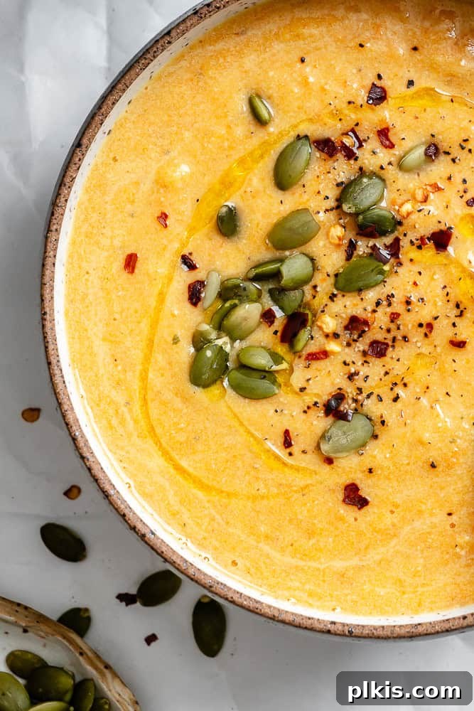 Golden Harvest Bisque 8 completed Roasted Pumpkin Soup in bowl, garnished and ready to serve