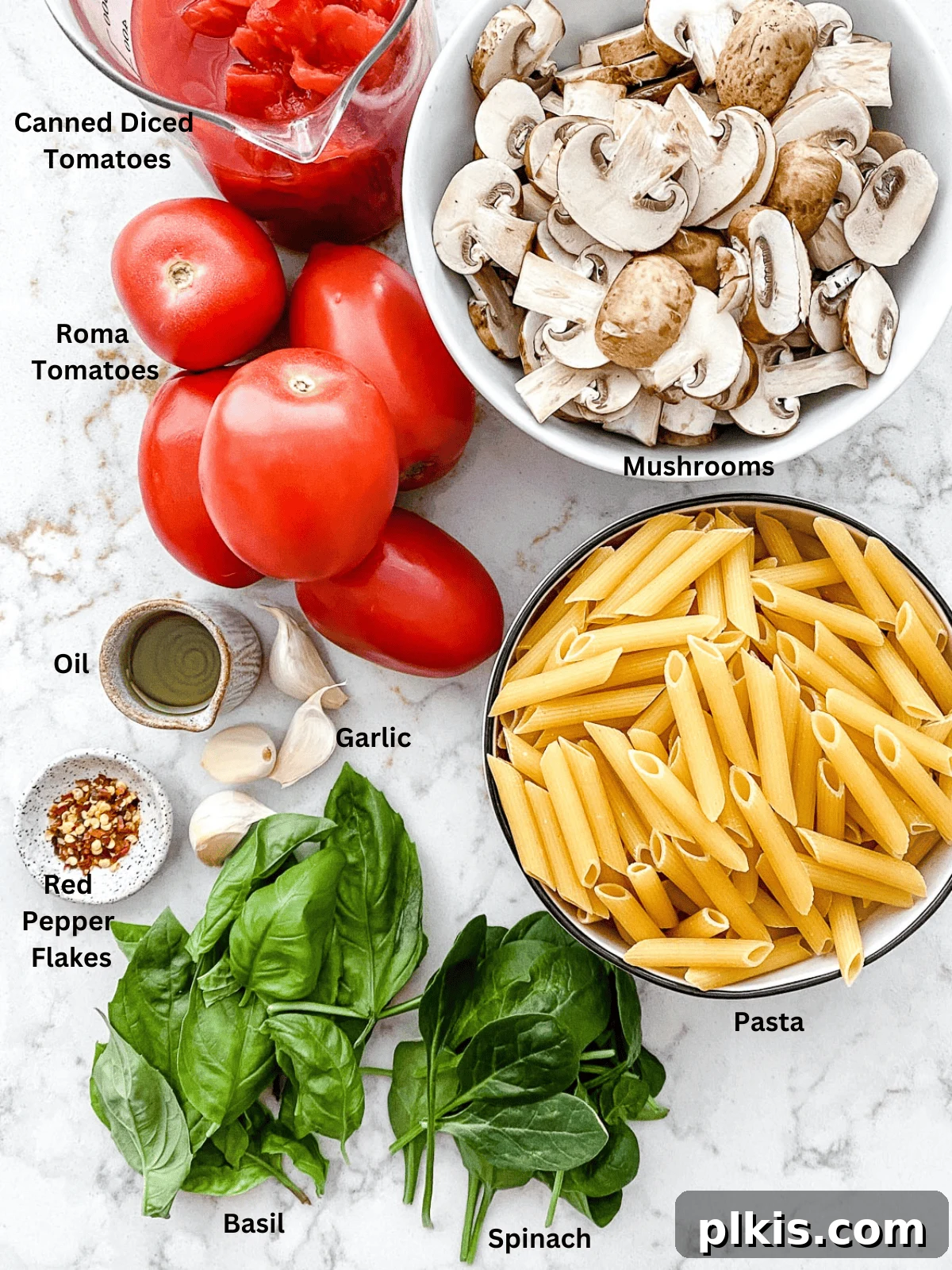 Fiery Basil Tomato Delight 3 Ingredients for Spicy Tomato Basil Pasta measured out on a white surface, including pasta, tomatoes, basil, garlic, and mushrooms.