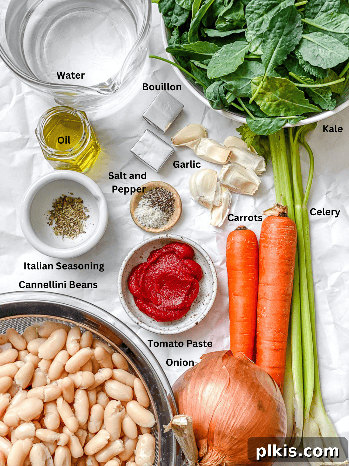 ingredients for Tuscan White Bean Soup [With Kale] on a white surface