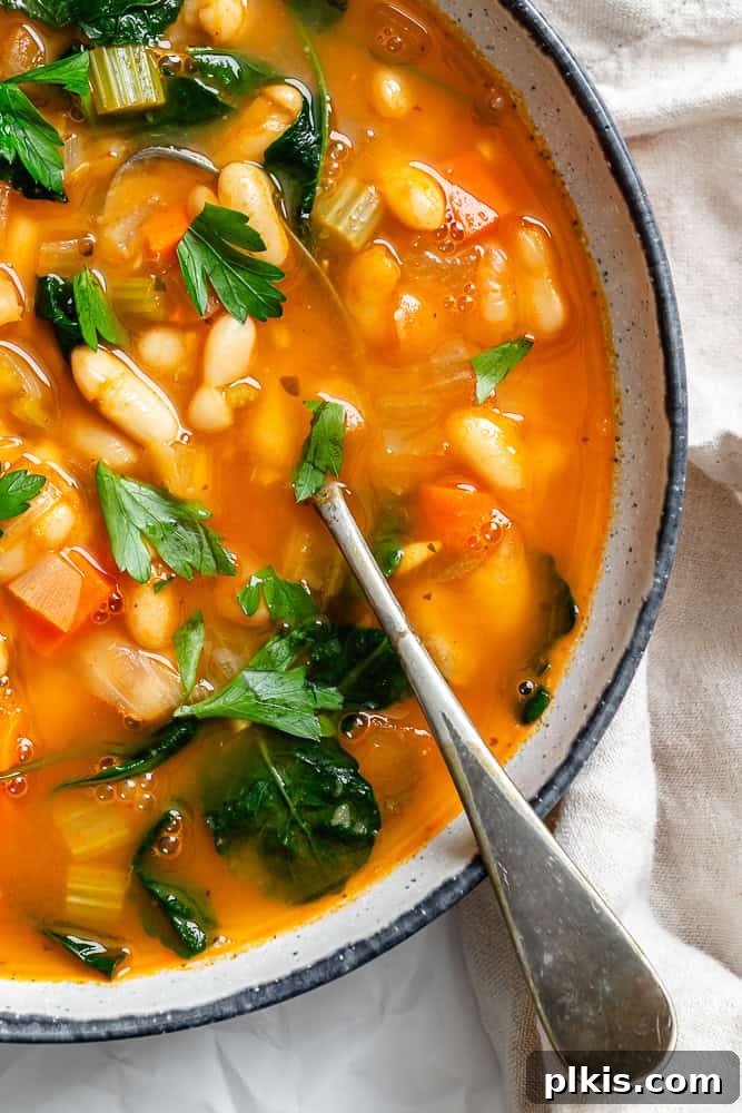 completed Tuscan White Bean Soup [With Kale] in a pot