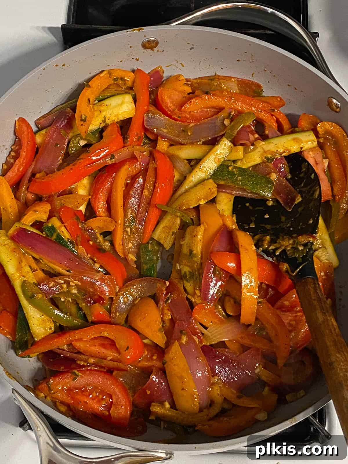Sizzling Plant-Powered Fajitas 11 process shot of mixed veggies being cooked in a pan