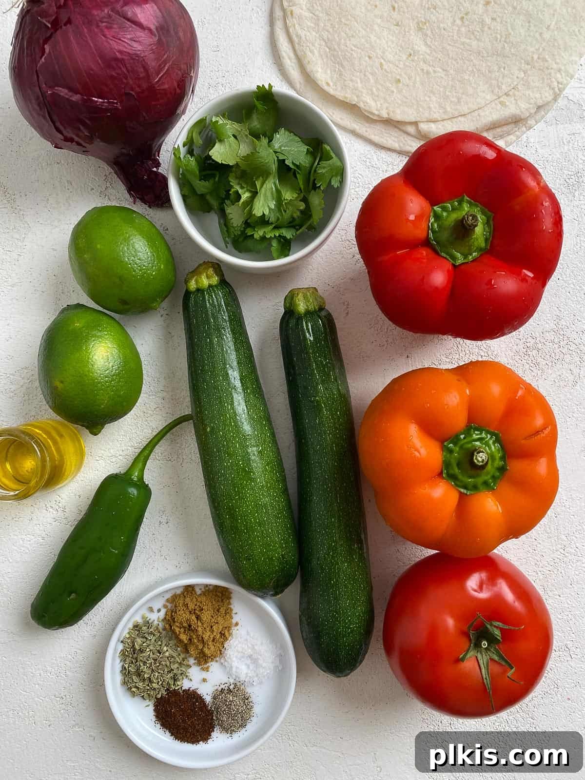 Sizzling Plant-Powered Fajitas 3 ingredients for Grilled Veggie Fajitas laid out on a white surface