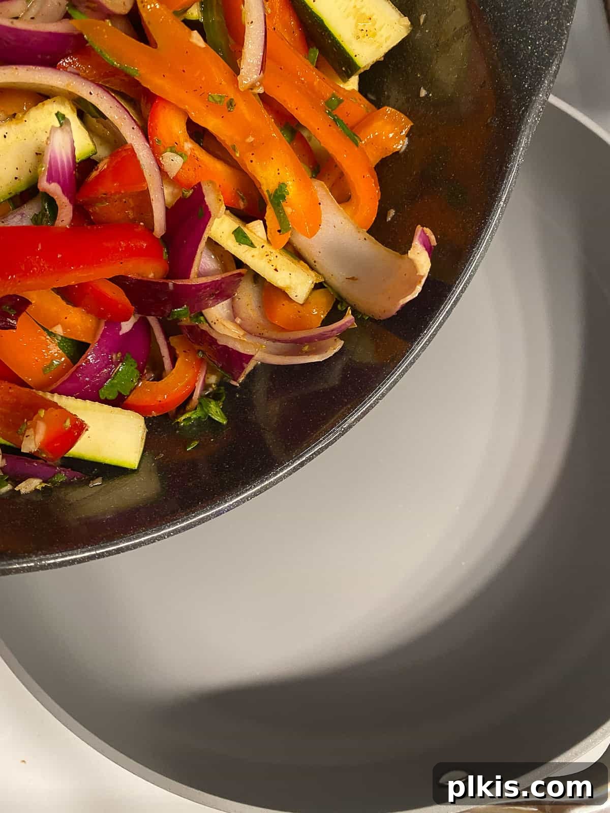 Sizzling Plant-Powered Fajitas 8 process shot of adding veggies to pan