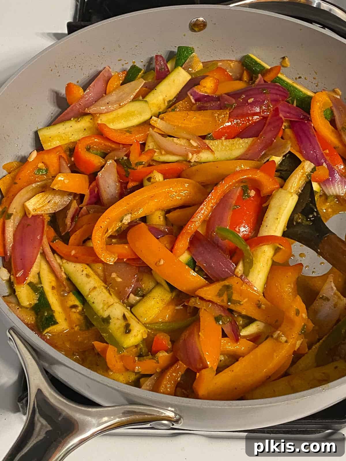 Sizzling Plant-Powered Fajitas 9 process shot of mixed veggies being cooked in a pan