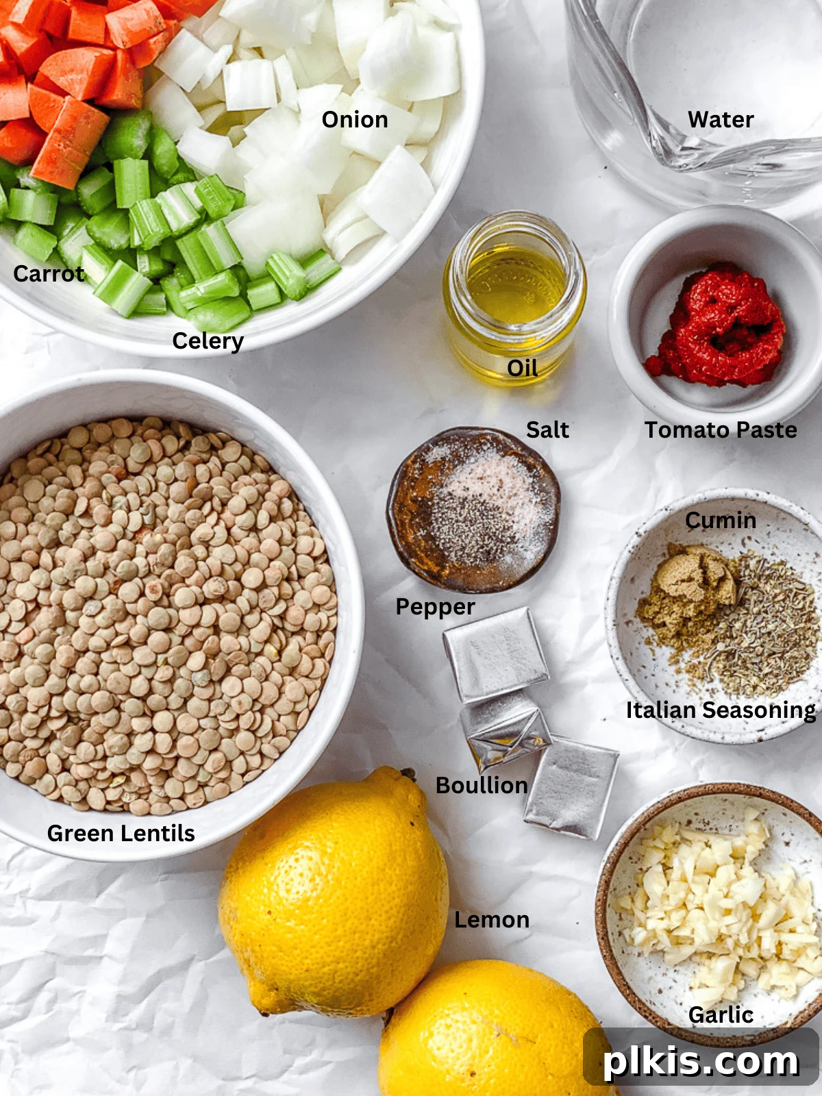 Sunshine Lentil Soup 3 Carefully measured ingredients for Lemon Lentil Soup, including diced vegetables, lentils, and spices, laid out on a clean white surface.