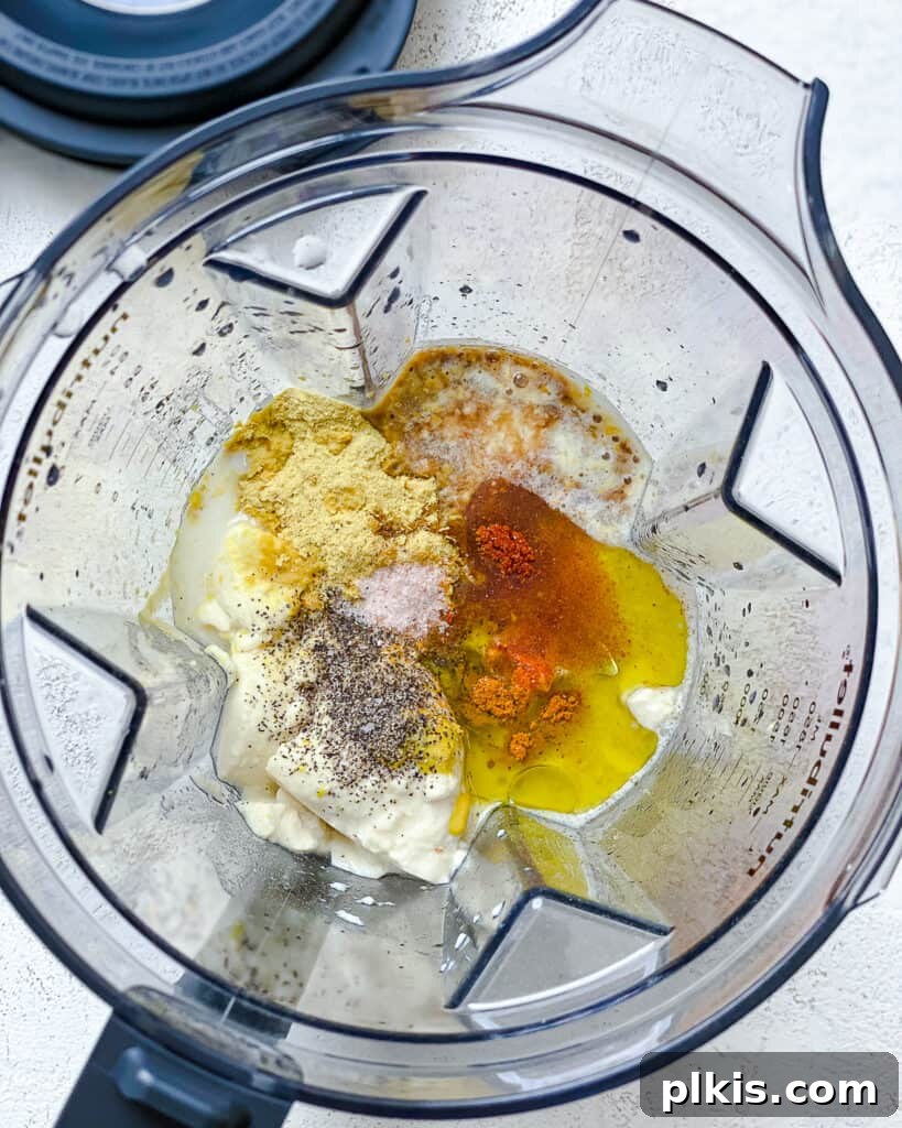 Simple Plant-Based Hollandaise 4 process shot of adding ingredients to blender