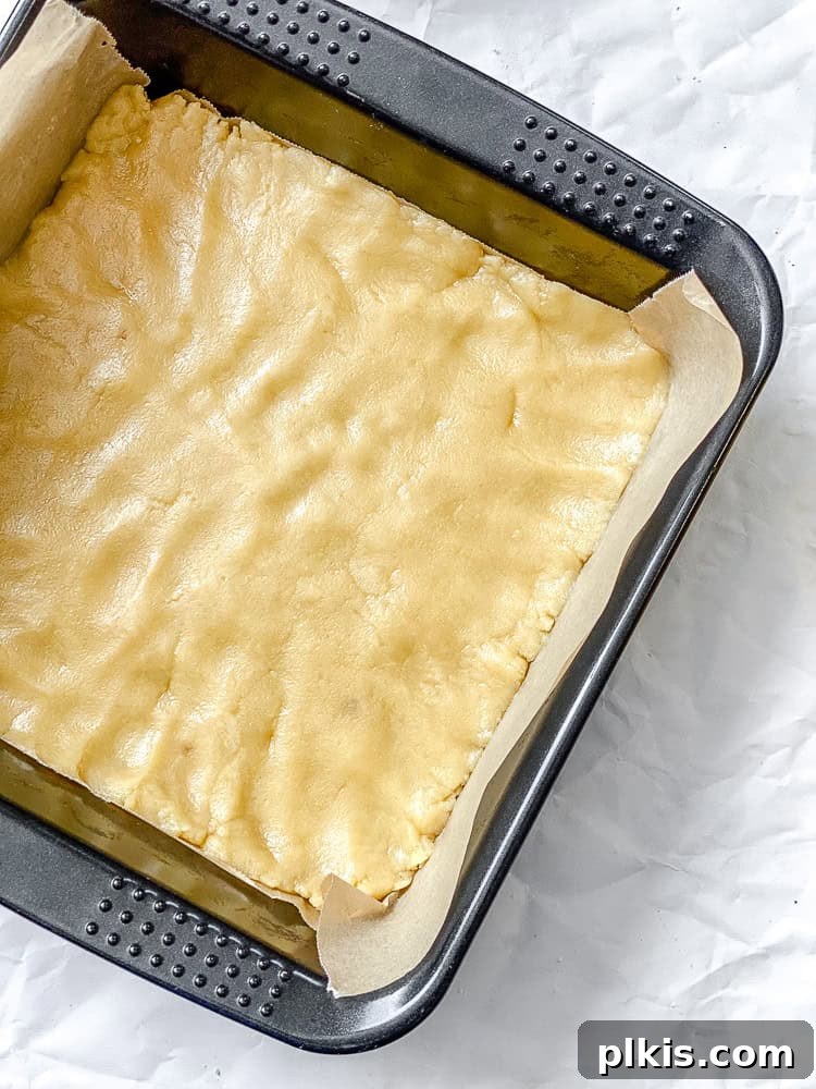 Sunshine Vegan Lemon Squares 5 process shot showing crust added and pressed into baking dish