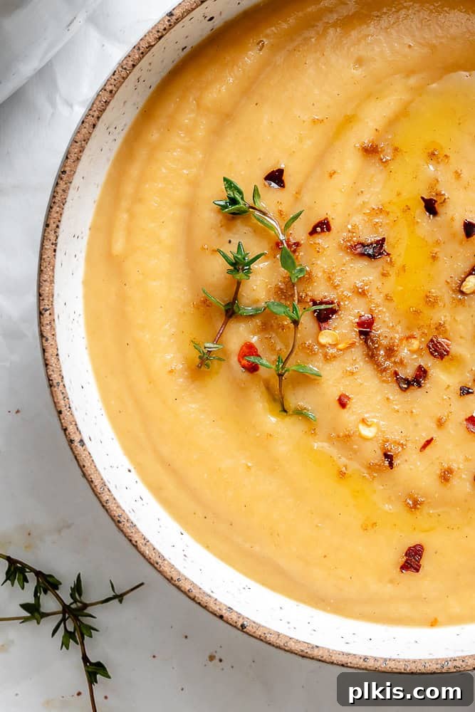 Maple-Kissed Roasted Parsnip Soup 2 A beautifully presented bowl of creamy Roasted Parsnip Soup, garnished and ready to be enjoyed.