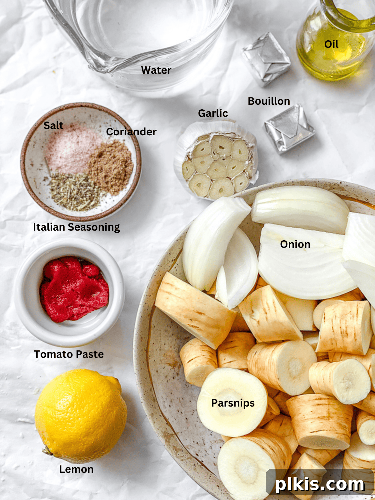 Maple-Kissed Roasted Parsnip Soup 3 A collection of fresh ingredients laid out, including parsnips, onions, garlic, and spices, ready for making Roasted Parsnip Soup.