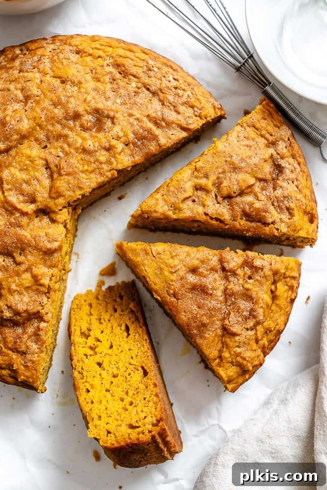 Spiced Butternut Delight 2 Slices of fluffy Butternut Squash Cake on a white plate, showcasing its moist texture and golden color.
