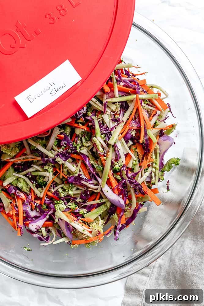 Zesty Broccoli Slaw 8 A tightly sealed storage container filled with fresh broccoli slaw, ready for refrigeration and future enjoyment.