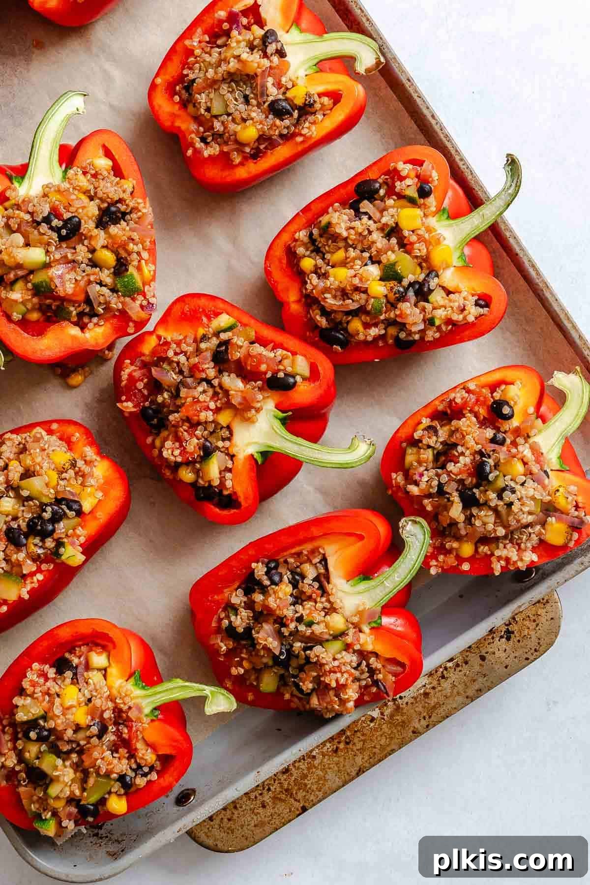 Wholesome Quinoa Stuffed Peppers 9 Process shot showing pre-baked Quinoa Stuffed Bell Peppers on baking tray.