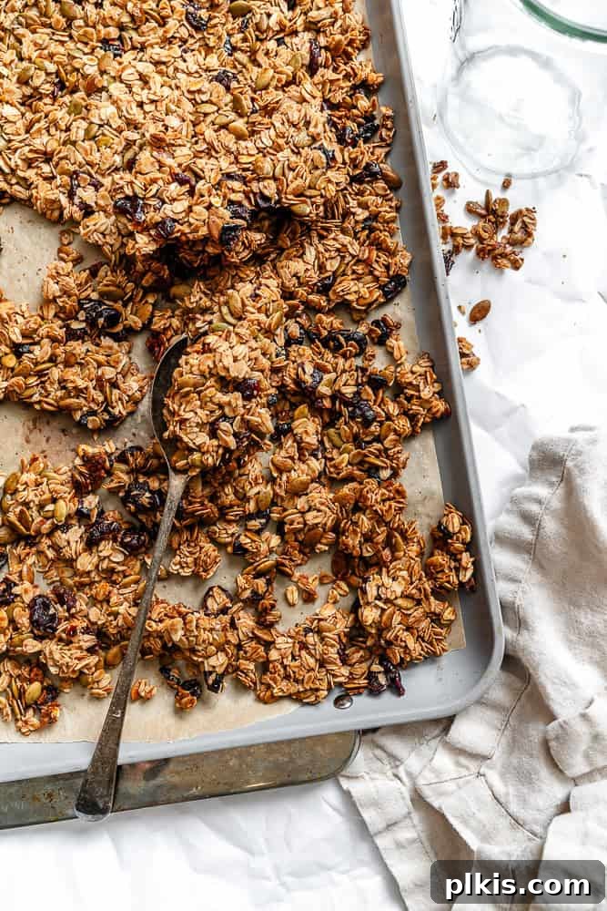 Spiced Maple Pumpkin Crunch 2 Crispy Maple Pumpkin Granola in a baking pan, ready to be enjoyed