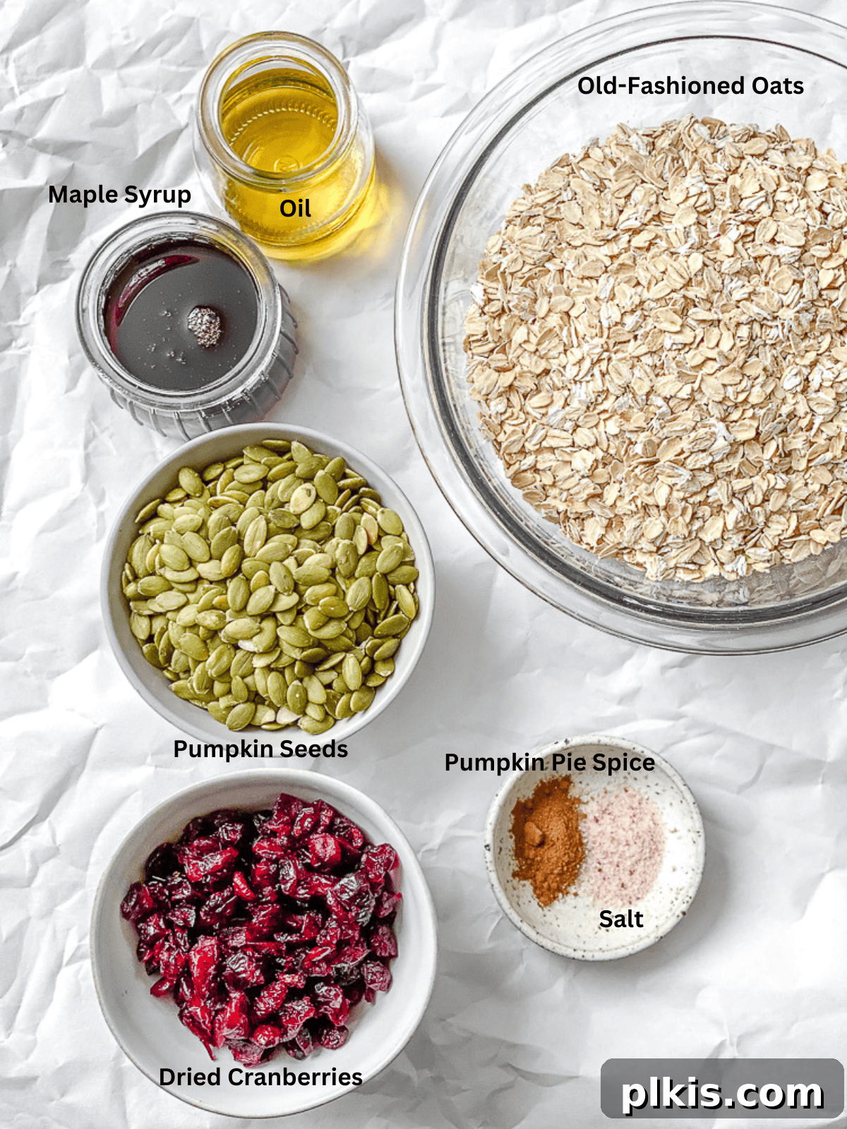 Spiced Maple Pumpkin Crunch 3 All ingredients for Maple Pumpkin Granola precisely measured and laid out on a clean white surface