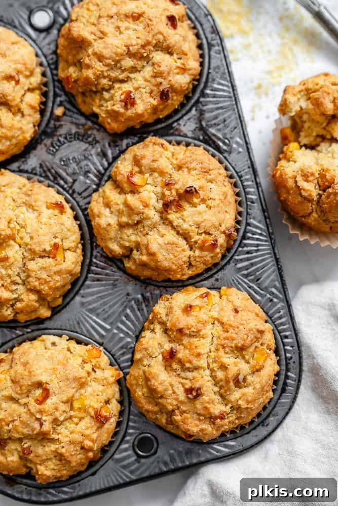 Fluffy Vegan Cornbread Muffins 2 completed Vegan Cornbread Muffins in a muffin tin