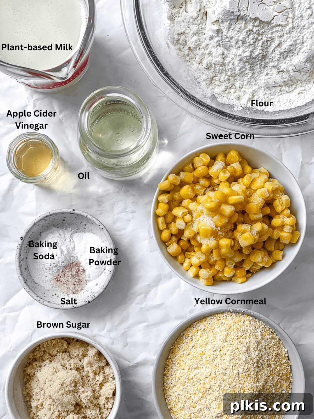 Fluffy Vegan Cornbread Muffins 3 ingredients for Vegan Cornbread Muffins measured out on a white surface
