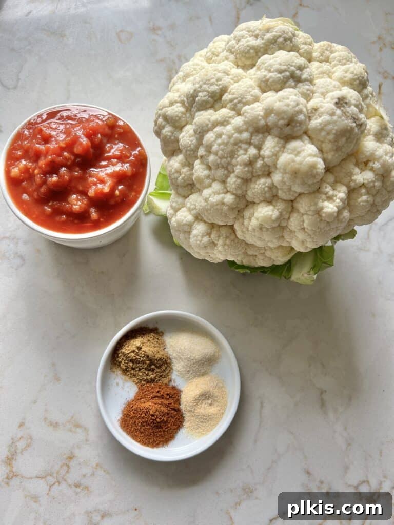 Quick and Flavorful Spanish Cauliflower Rice Bowl with Salsa 3 Spanish Cauliflower Rice ingredients on a white marble background