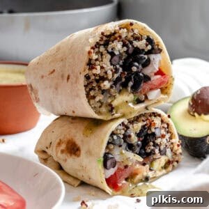 Hearty Quinoa Black Bean Burritos 10 completed Quinoa Black Bean Burritos stacked on one another