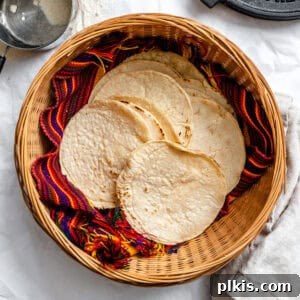 Crafting Perfect Corn Tortillas at Home 10 completed Homemade Corn Tortillas in a basket