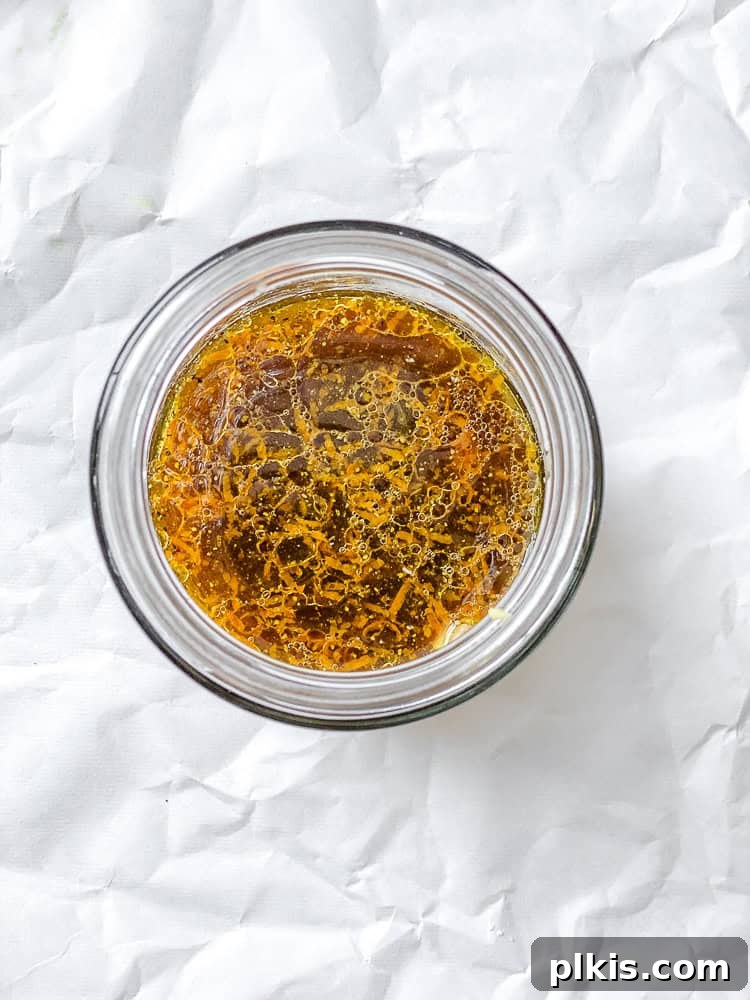 Bright Orange Vinaigrette 5 process shot showing vinaigrette ingredients combined in a small jar