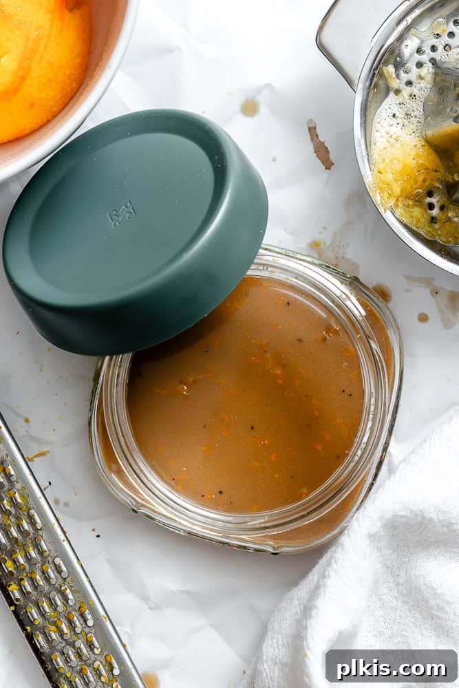 Bright Orange Vinaigrette 6 completed Easy Orange Vinaigrette in a storage container, ready for refrigeration
