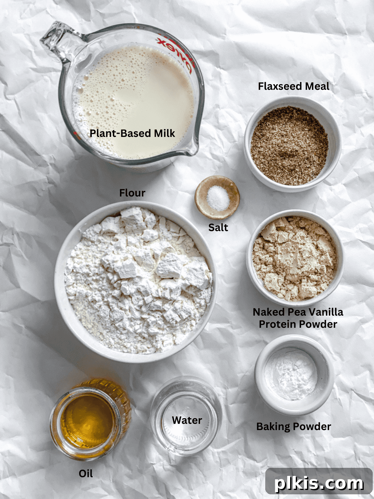 Fluffy Vegan Power Cakes 3 ingredients for Vegan Protein Pancakes measured out on a white surface