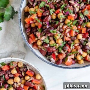Completed mixed bean salad in a serving bowl and individual bowl.
