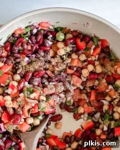 Final mixing of ingredients for the Mexican bean salad.