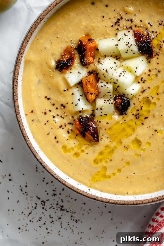 Sweet Autumn Squash and Apple Bisque 8 Completed Butternut Squash and Apple Soup in a bowl, ready to serve.