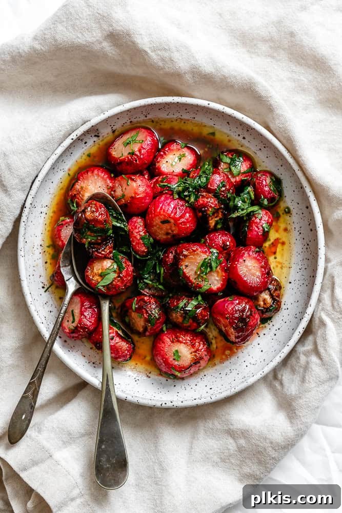 Roasted Radish Revelation 2 Perfectly roasted radishes, vibrant and tender, served on a plate as a delicious side dish.