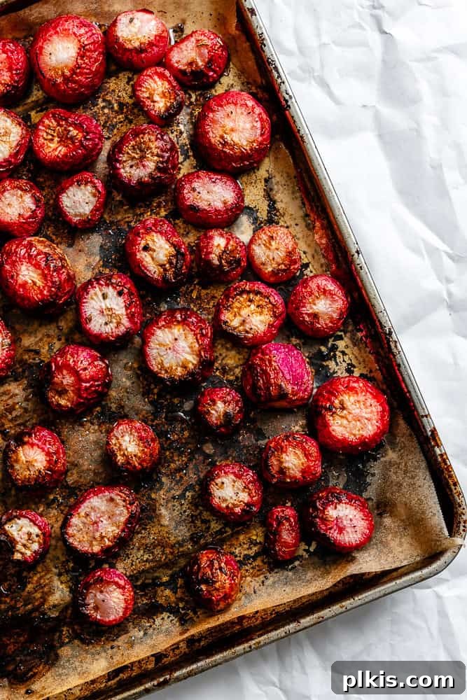 Roasted Radish Revelation 6 Process shot showing radishes spread in a single layer on a baking sheet, ready for roasting.
