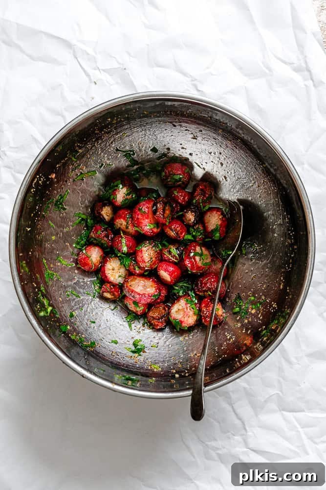 Roasted Radish Revelation 7 Process shot showing perfectly roasted radishes on a plate, tossed with fresh parsley.