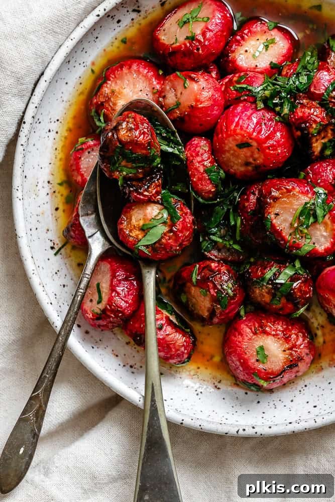 Roasted Radish Revelation 8 A serving of perfectly cooked roasted radishes, golden and tender, presented on a white plate with fresh herbs.