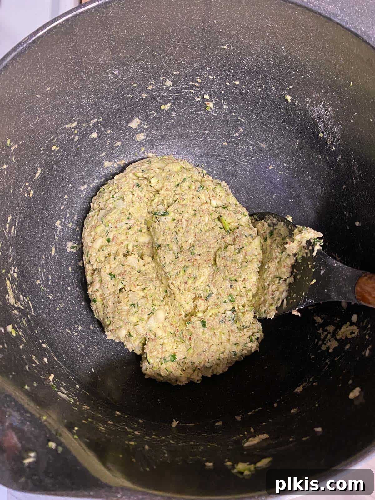 Wholesome Baked Plant-Based Zucchini Fritters 10 post mixing zucchini mixture in bowl